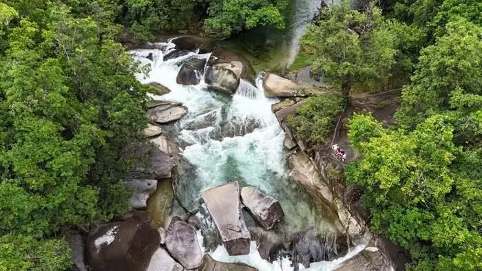 Aerial view of Devils Pool at Babinda Boulders surrounded by rainforest